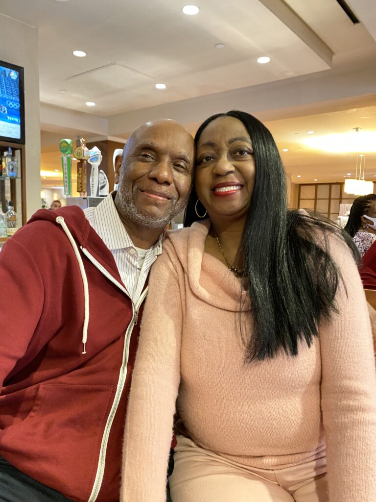 A man and woman posing for the camera.