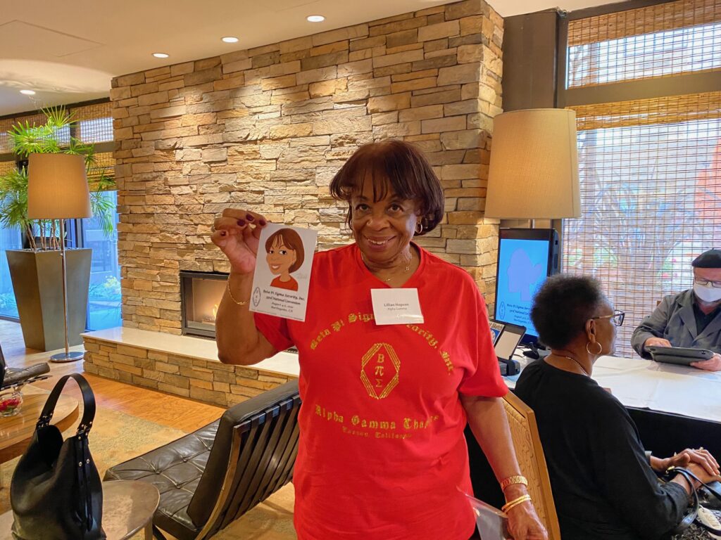 A woman holding up an image of herself.