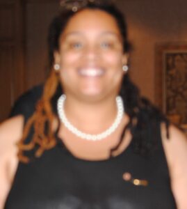 Blurred image of a lady wearing black dress